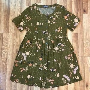 Beautiful vintage-style dress with whimsical pattern.